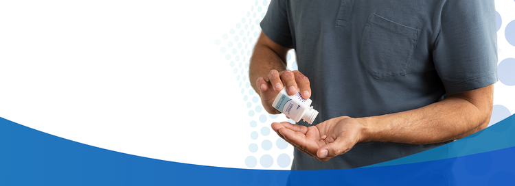 male patient with CIBINQO™ (abrocitinib) pill in hand
