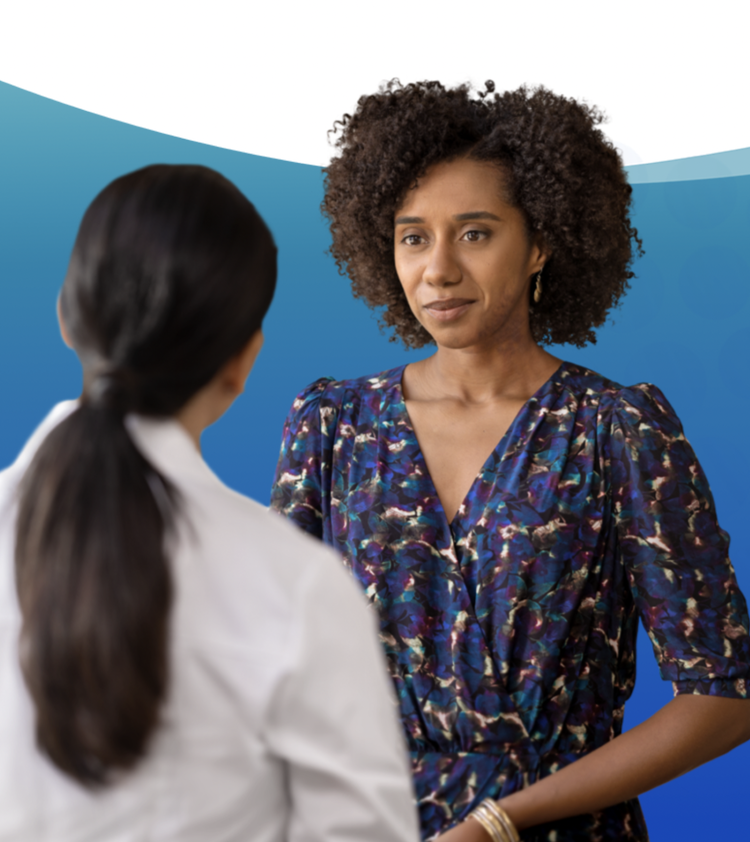 female doctor speaking with female patient
